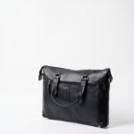 Leather laptop bag with brass buckles and adjustable shoulder strap