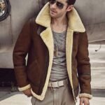 Men's brown jacket with a skin fur collar.