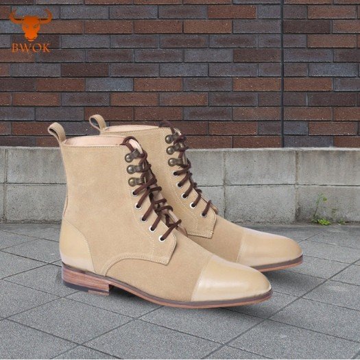 Classic beige cap toe lace up Oxford boots for men on urban background