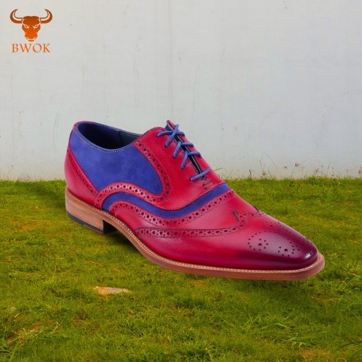 Stylish two-tone wingtip brogues available globally.