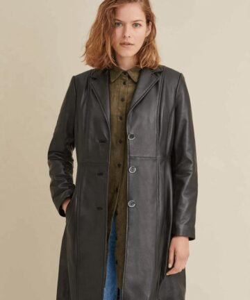 Woman wearing a fashionable leather trench coat.