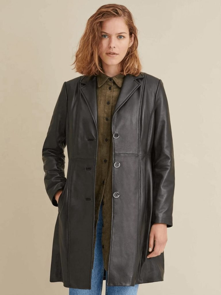 Woman wearing a fashionable leather trench coat.