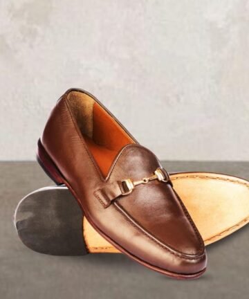 Polished brown men's leather loafers with gold horsebit.