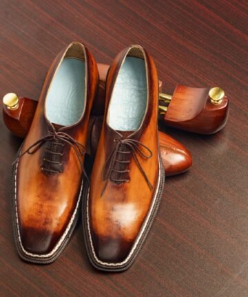 Polished brown leather Oxford dress shoes.