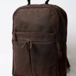 Leather laptop backpack in full-grain brown leather with padded straps