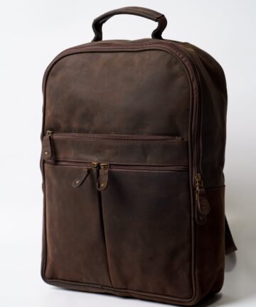 Leather laptop backpack in full-grain brown leather with padded straps
