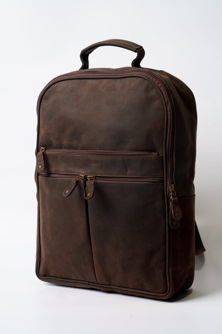 Leather laptop backpack in full-grain brown leather with padded straps