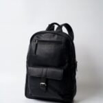 Black travel backpack with USB port and laptop compartment