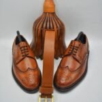 Sleek black leather Oxford shoes showcase classic design.