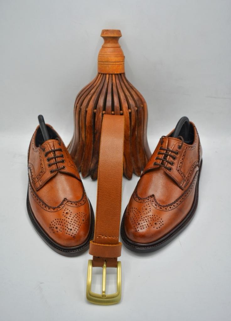 Sleek black leather Oxford shoes showcase classic design.