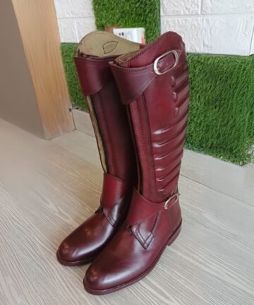 Pair of burgundy leather horse riding boots.