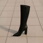 Black knee-high boots with block heels on a tiled floor