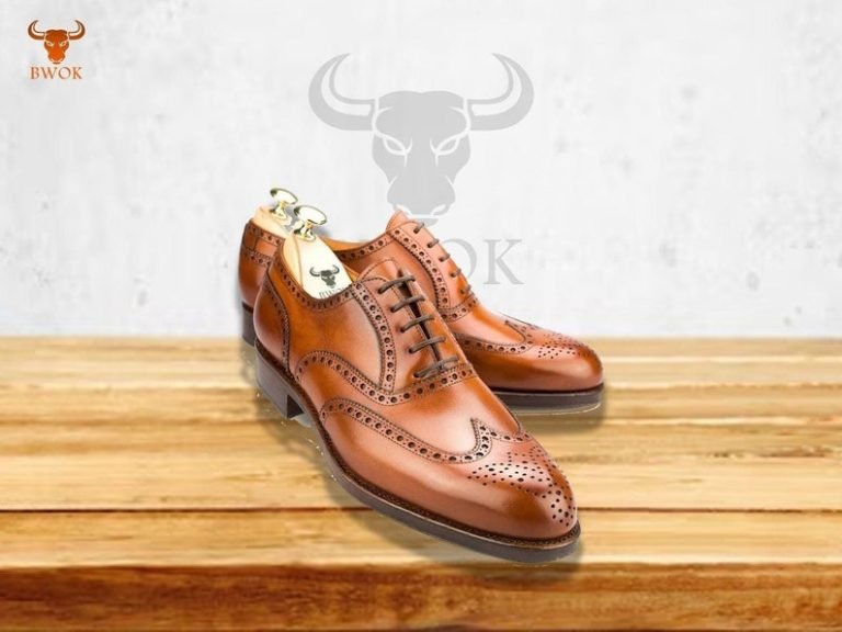 Polished black leather Oxford shoes.