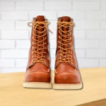 Pair of Moc Toe Leather Boots on wooden surface – Bwok Store