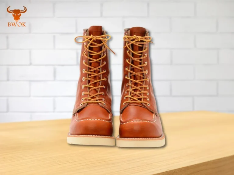 Pair of Moc Toe Leather Boots on wooden surface – Bwok Store