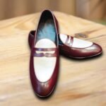 Maroon men’s loafers shoes on wooden surface with soft inner lining