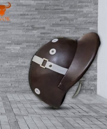 Dark brown horse riding helmet with chin strap on gray tiled background