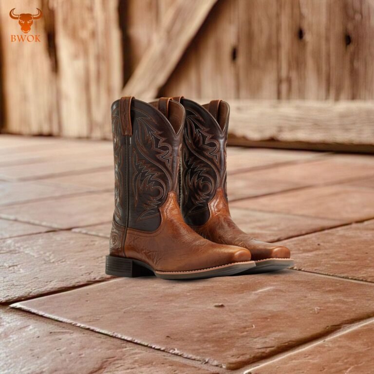 Pair of Western leather cowboy boots on rustic tiled floor - Bwok Store