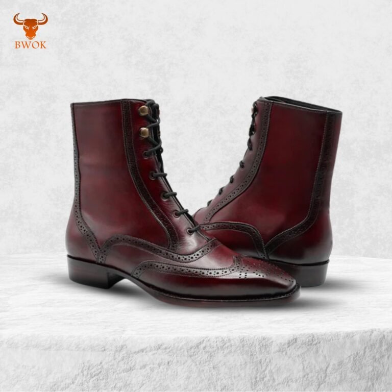 Burgundy leather ankle boots on display with classic stitching