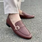 Handmade leather shoes by Bwok – Elegant brown loafers with a gold buckle, perfect for formal and casual wear.