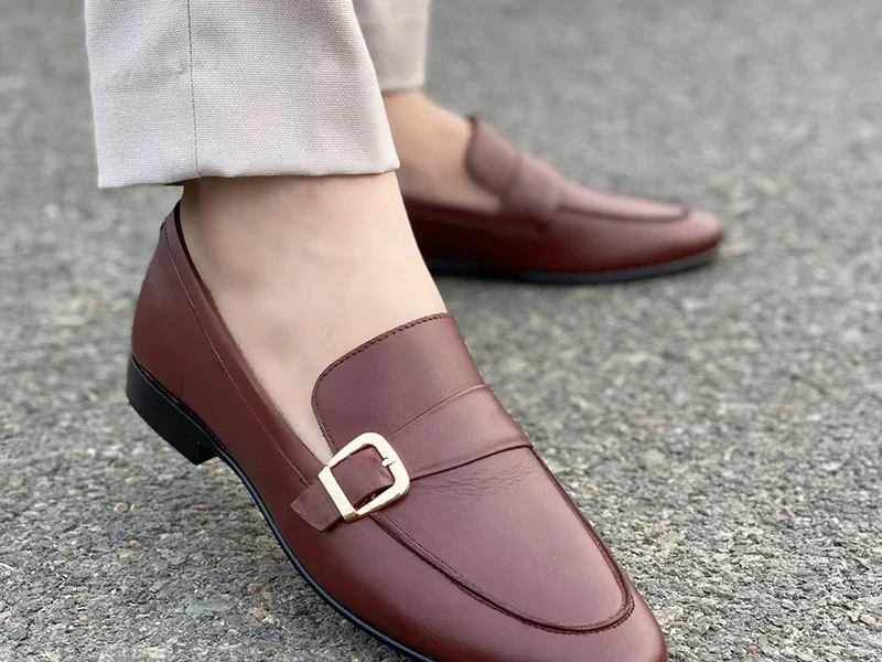 Handmade leather shoes by Bwok – Elegant brown loafers with a gold buckle, perfect for formal and casual wear.